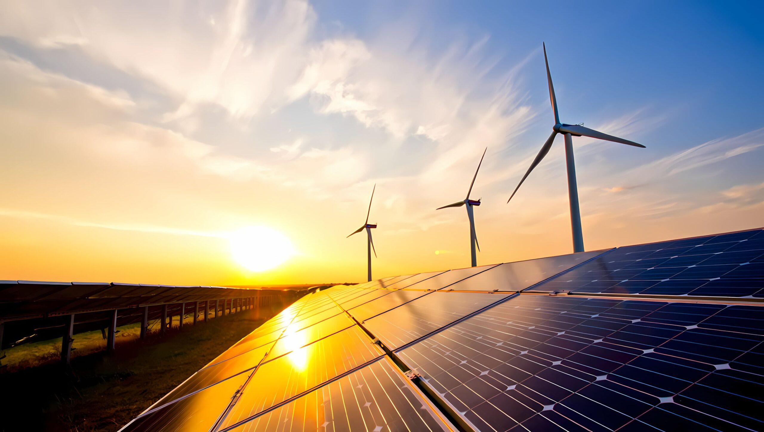Solar Panels and Wind Turbines Reflecting a Golden Sunset Sky